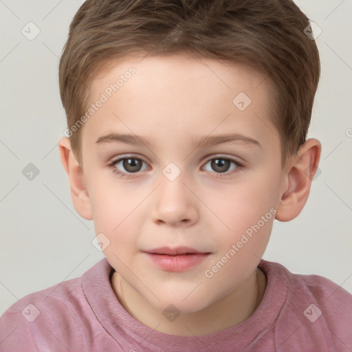 Joyful white child male with short  brown hair and brown eyes