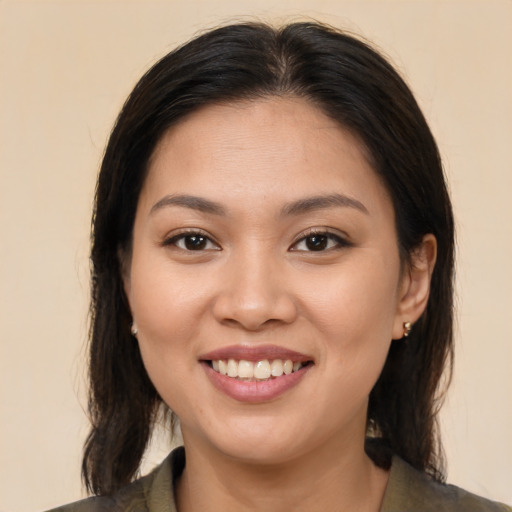 Joyful white young-adult female with medium  brown hair and brown eyes