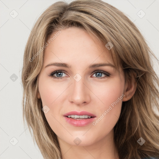 Joyful white young-adult female with long  brown hair and green eyes