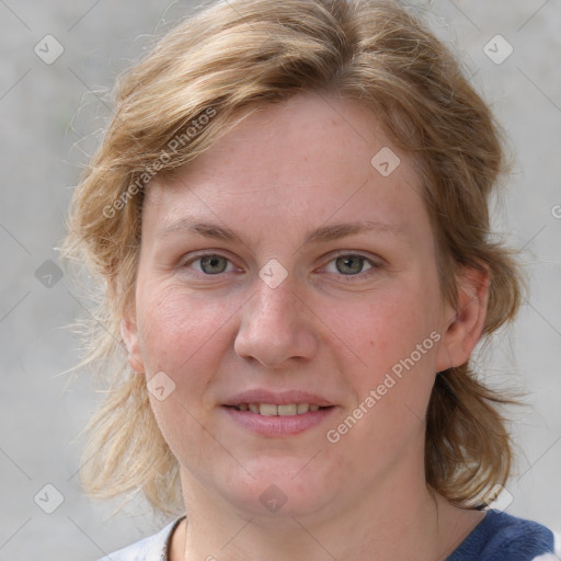 Joyful white young-adult female with medium  brown hair and blue eyes