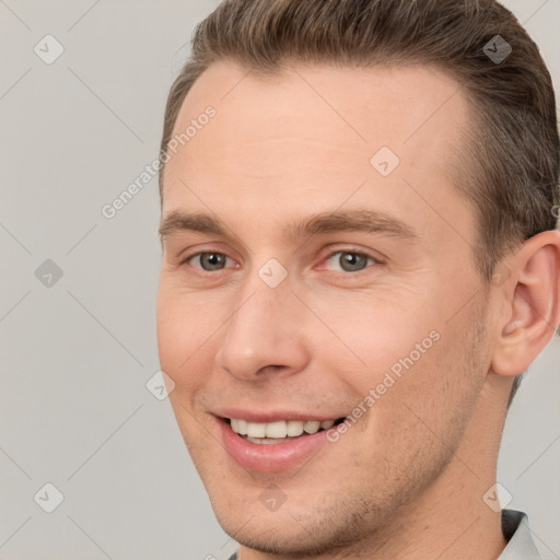 Joyful white young-adult male with short  brown hair and brown eyes