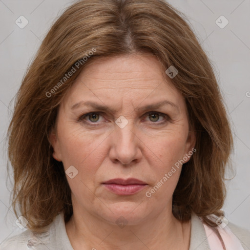 Joyful white adult female with medium  brown hair and grey eyes