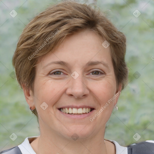 Joyful white adult female with short  brown hair and brown eyes