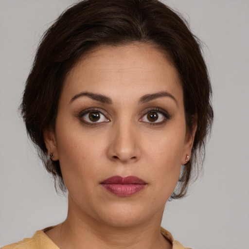 Neutral white young-adult female with short  brown hair and brown eyes
