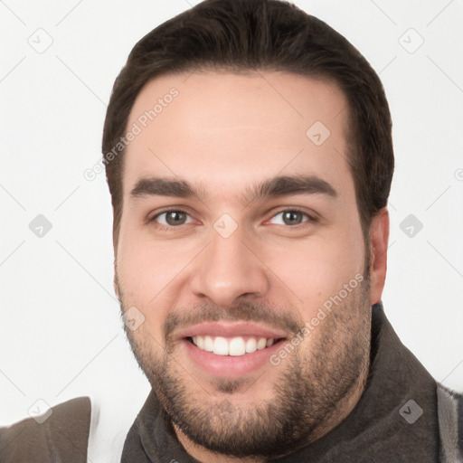 Joyful white young-adult male with short  brown hair and brown eyes