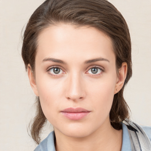 Neutral white young-adult female with medium  brown hair and grey eyes