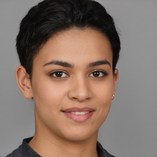 Joyful latino young-adult female with short  brown hair and brown eyes