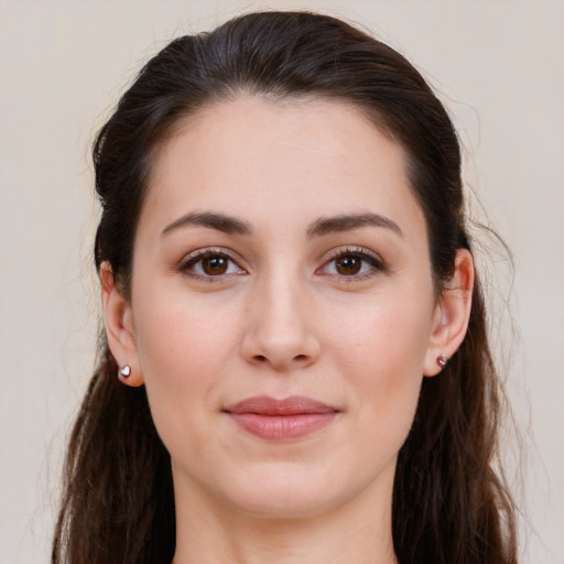 Joyful white young-adult female with long  brown hair and brown eyes