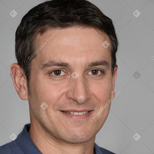 Joyful white adult male with short  brown hair and brown eyes