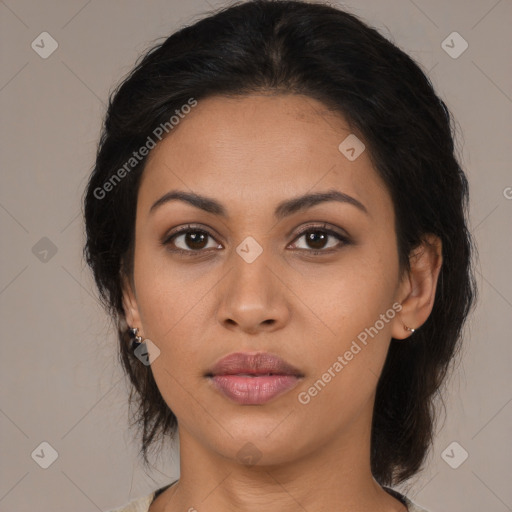 Joyful latino young-adult female with medium  brown hair and brown eyes