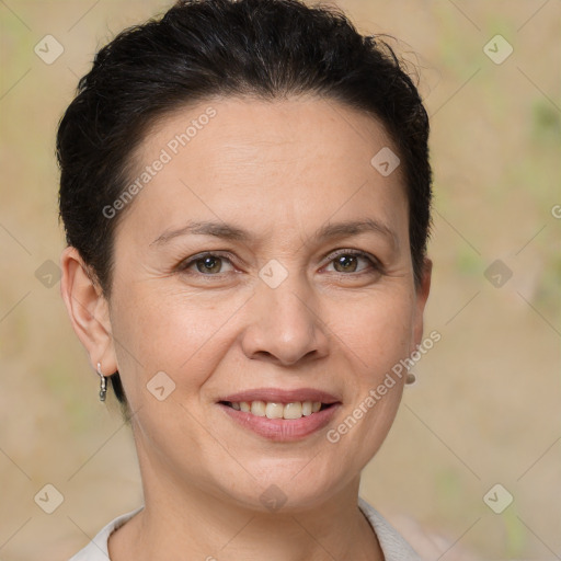 Joyful white adult female with short  brown hair and brown eyes