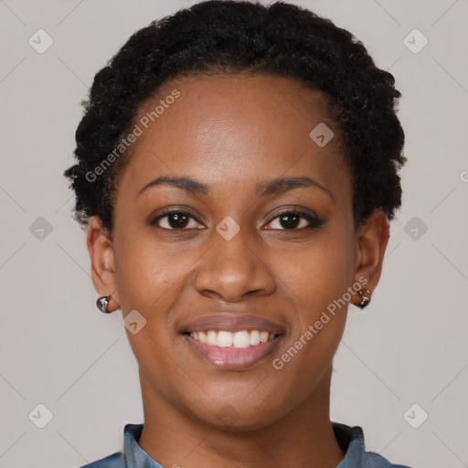 Joyful black young-adult female with short  black hair and brown eyes