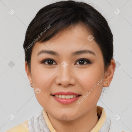 Joyful asian young-adult female with short  brown hair and brown eyes