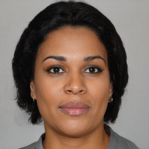 Neutral black young-adult female with medium  black hair and brown eyes