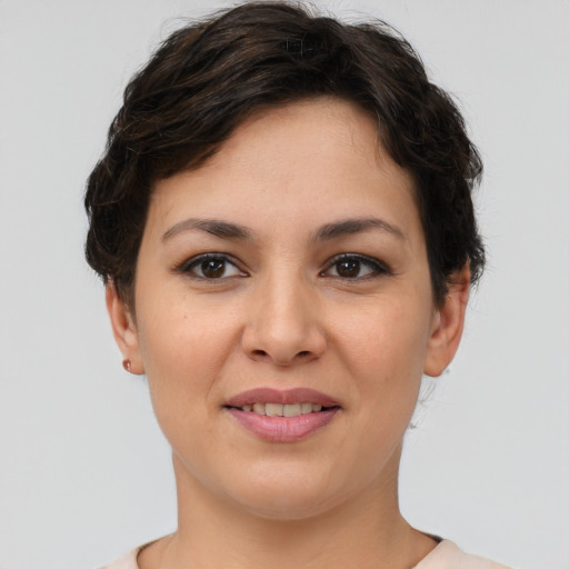 Joyful asian young-adult female with short  brown hair and brown eyes