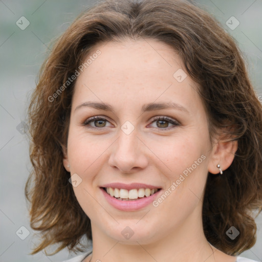 Joyful white young-adult female with medium  brown hair and green eyes