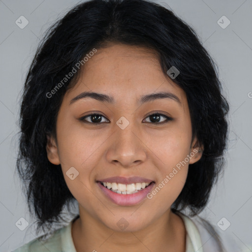 Joyful latino young-adult female with long  brown hair and brown eyes