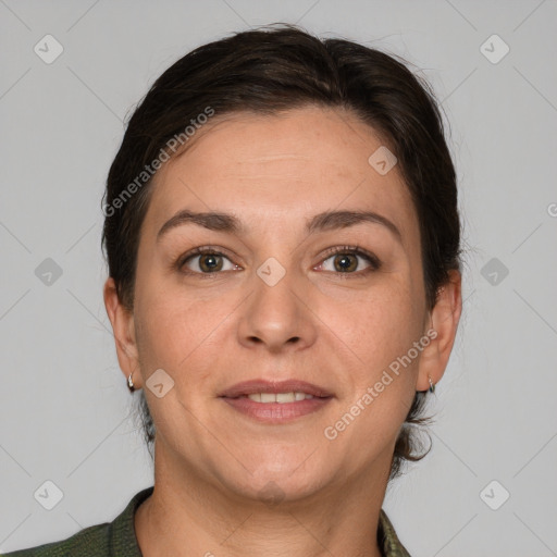 Joyful white adult female with short  brown hair and grey eyes