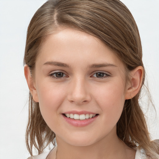 Joyful white child female with medium  brown hair and brown eyes