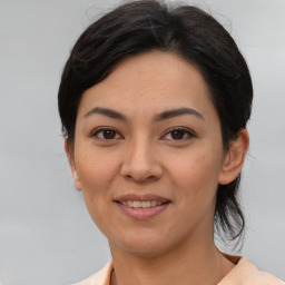 Joyful asian young-adult female with medium  brown hair and brown eyes