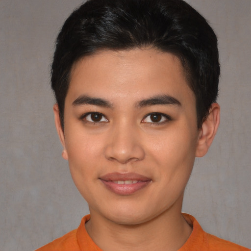 Joyful asian young-adult male with short  black hair and brown eyes