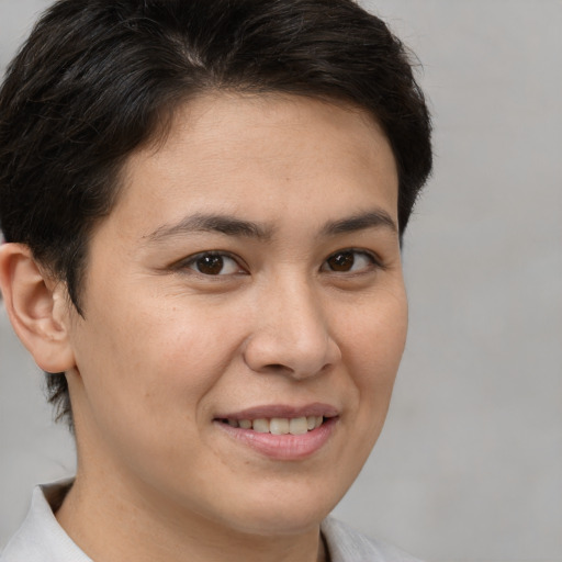 Joyful white young-adult female with short  brown hair and brown eyes