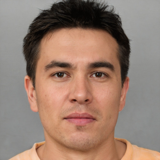 Neutral white young-adult male with short  brown hair and brown eyes