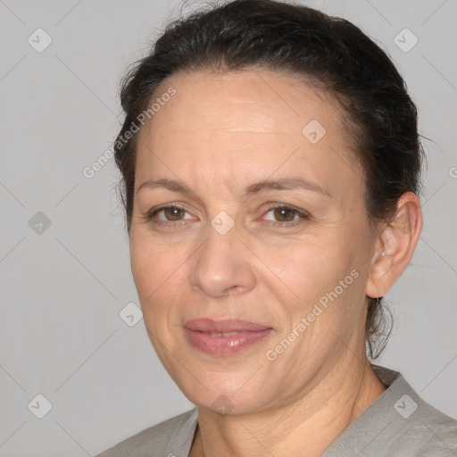 Joyful white adult female with short  brown hair and brown eyes