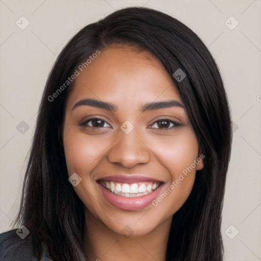 Joyful latino young-adult female with long  black hair and brown eyes