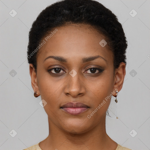 Joyful black young-adult female with short  black hair and brown eyes