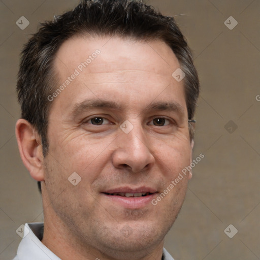 Joyful white adult male with short  brown hair and brown eyes