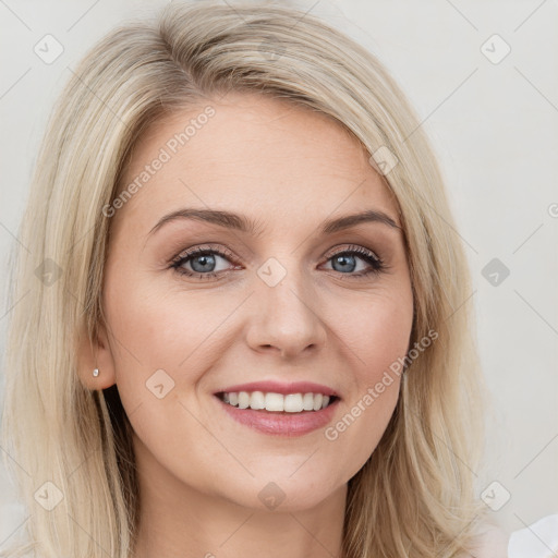 Joyful white young-adult female with long  brown hair and blue eyes