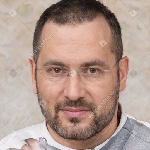 Joyful white adult male with short  brown hair and brown eyes