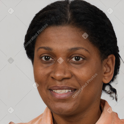 Joyful black adult female with short  brown hair and brown eyes