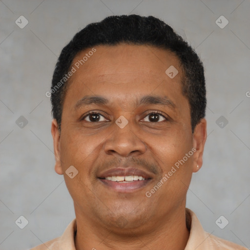 Joyful black adult male with short  black hair and brown eyes