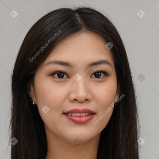 Joyful asian young-adult female with long  brown hair and brown eyes