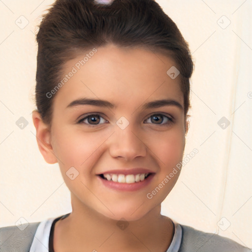 Joyful white child female with short  brown hair and brown eyes