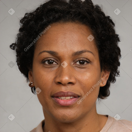 Joyful black adult female with short  brown hair and brown eyes