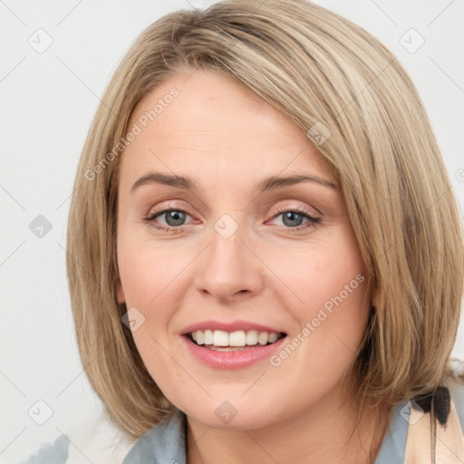 Joyful white young-adult female with medium  brown hair and blue eyes