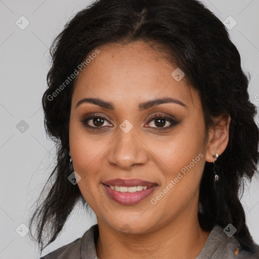 Joyful latino adult female with medium  brown hair and brown eyes