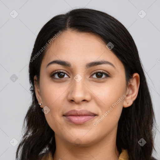 Joyful latino young-adult female with long  brown hair and brown eyes