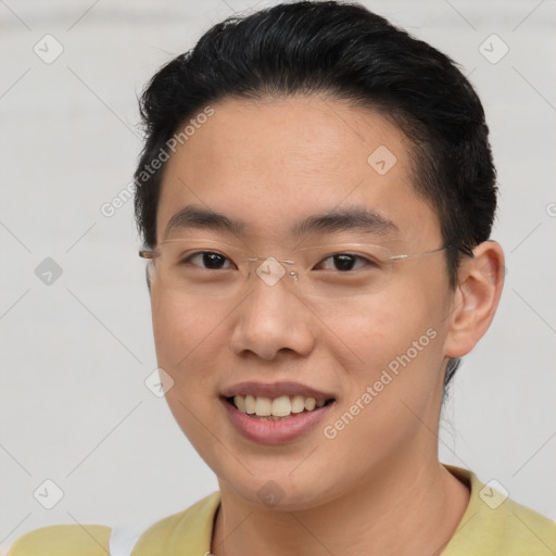 Joyful asian young-adult male with short  brown hair and brown eyes