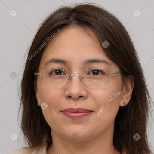 Joyful white adult female with long  brown hair and brown eyes