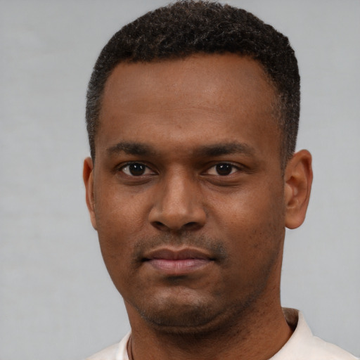Neutral black young-adult male with short  black hair and brown eyes