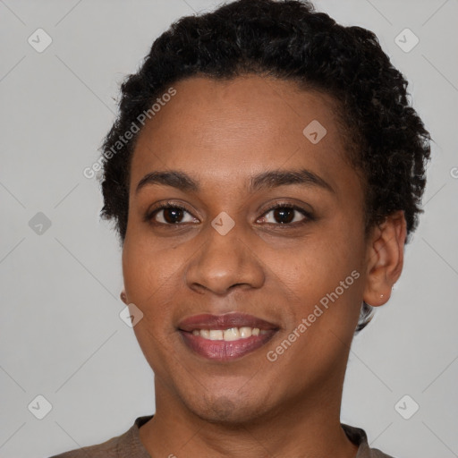 Joyful black young-adult female with short  brown hair and brown eyes