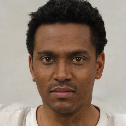 Neutral black young-adult male with short  black hair and brown eyes