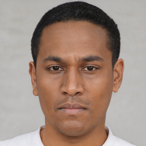 Neutral latino young-adult male with short  black hair and brown eyes