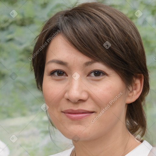 Joyful white adult female with medium  brown hair and brown eyes