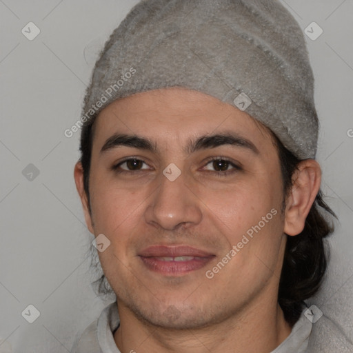 Joyful white young-adult male with short  black hair and brown eyes