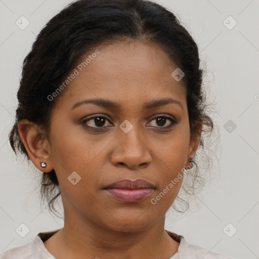 Joyful black young-adult female with medium  brown hair and brown eyes